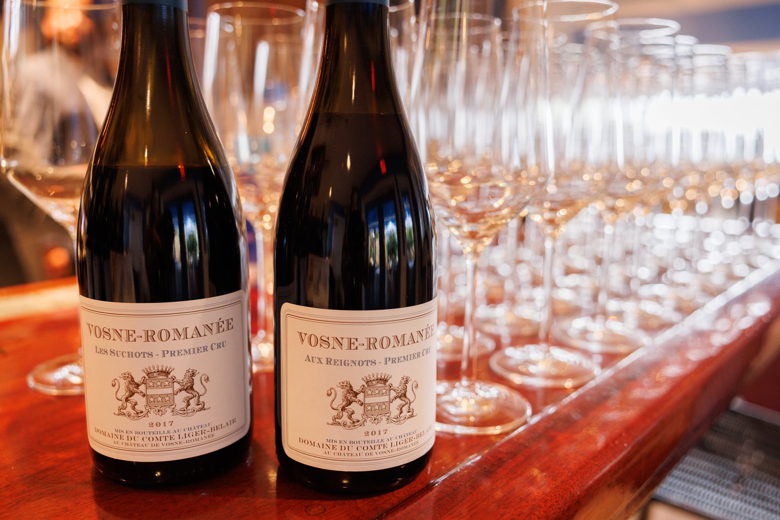 Burgundy bottles and tasting glasses at the Naples Winter Wine Festival